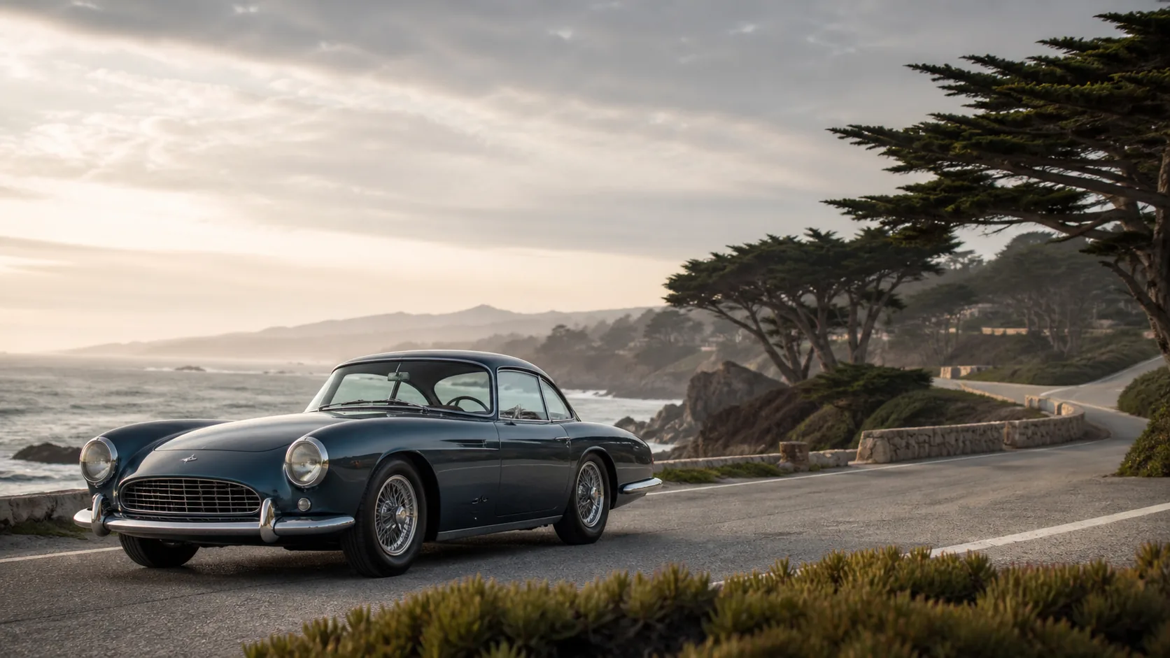 Monterey collector car market banner with coastal road, cypress trees, and a blue-chip vintage European collector car.